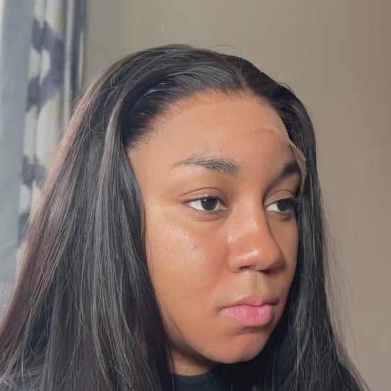 A close-up of a raw Indian hair wig with glueless HD lace and raw Indian hair. The wig is styled in a sleek, straight style and the lace is transparent.
